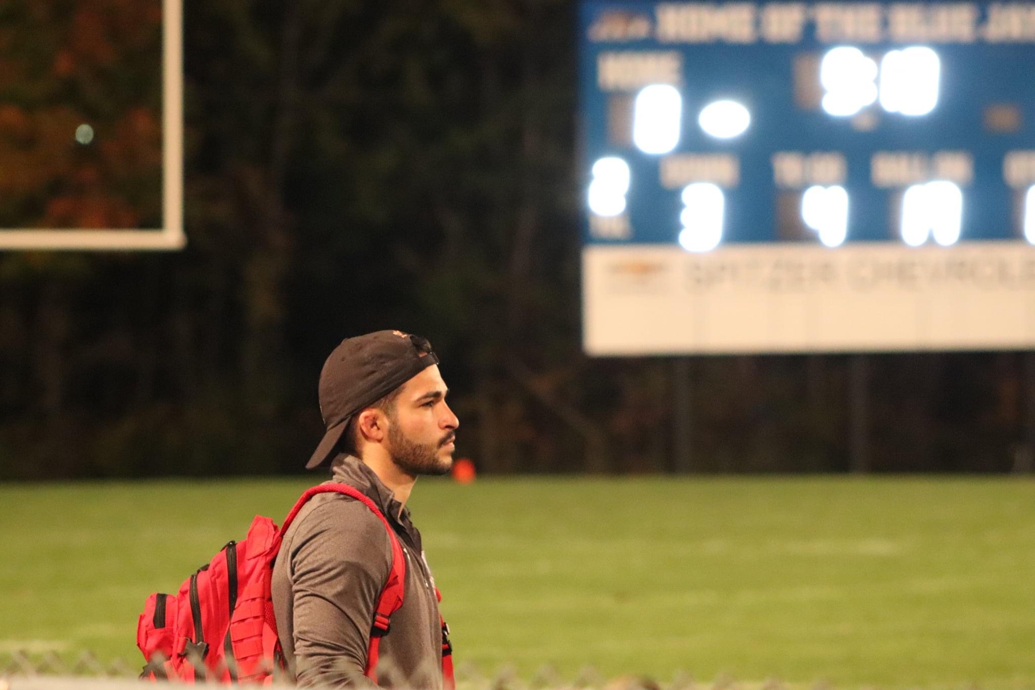 OSSI Anthony Craig on sidelines of high school football game